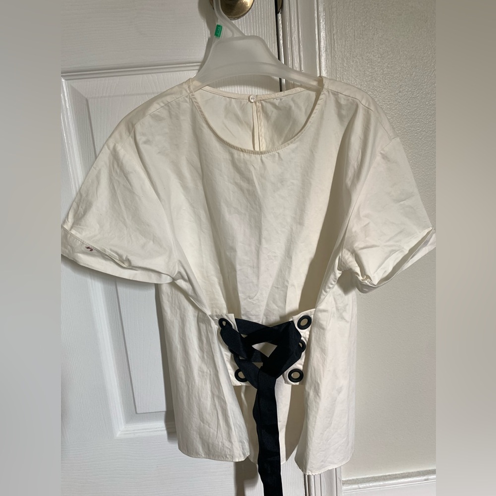 Zara women’s white top with zigzag ribbon.